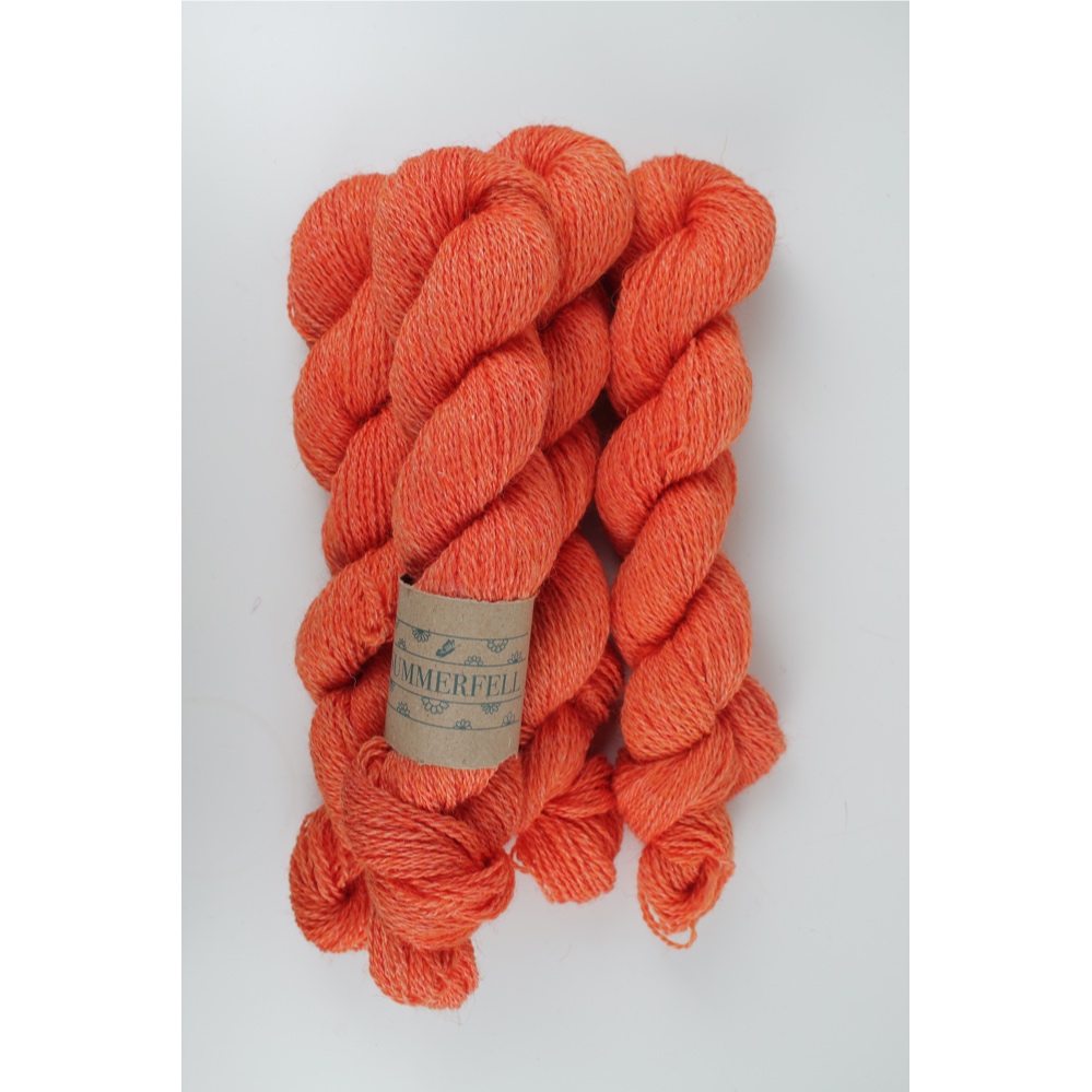 Bright orange dyed skeins of Summerfell