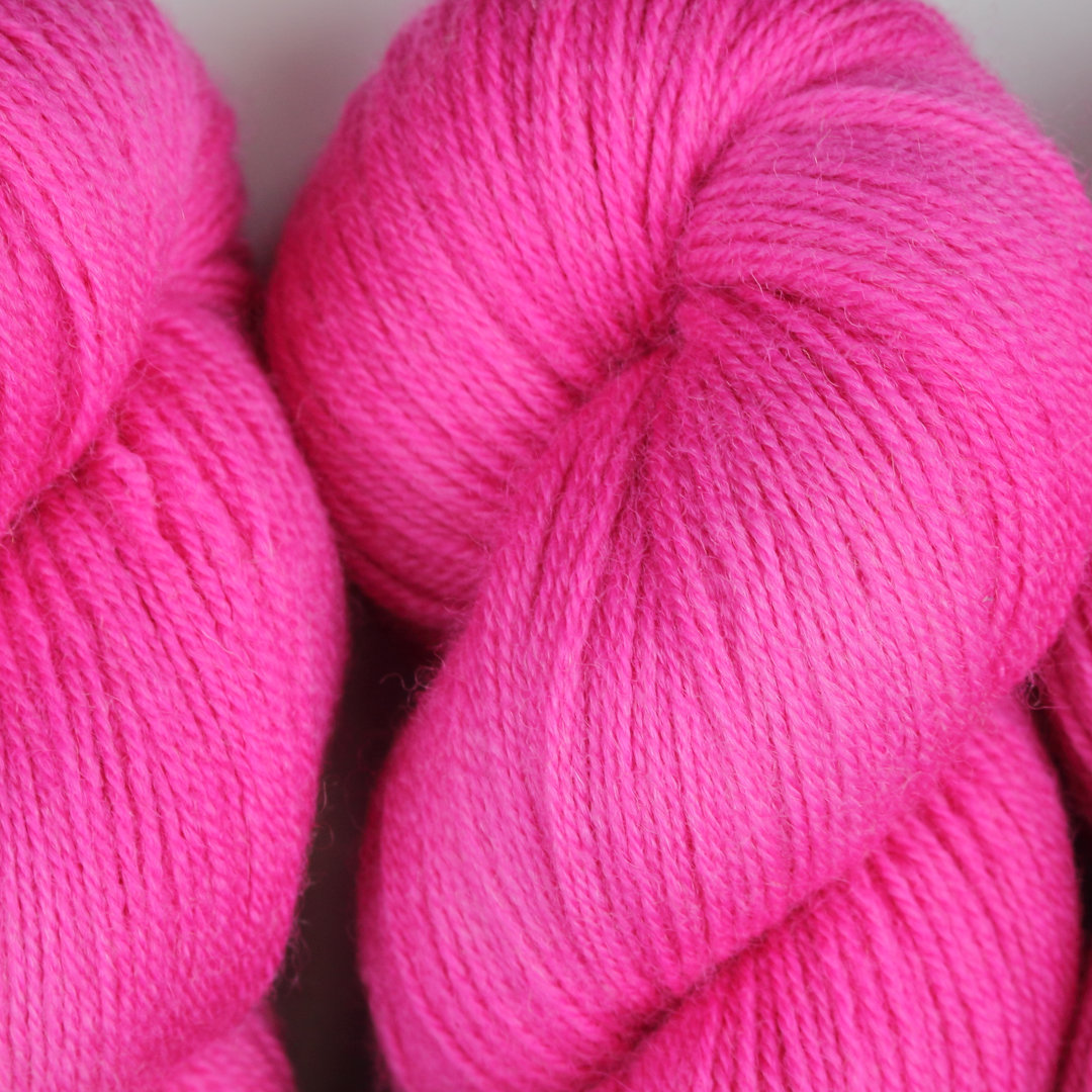 Bright pink skeins of Nene 4 Ply