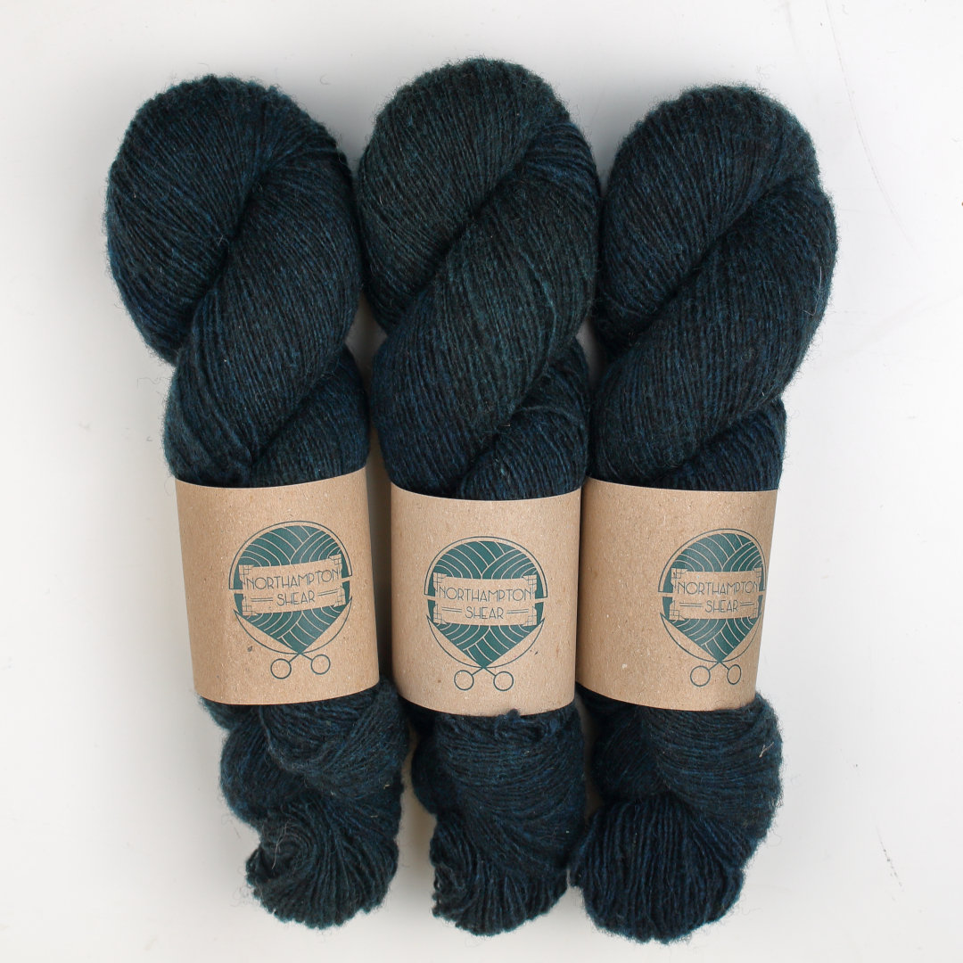 Deep dark teal skeins of Shetland Lace