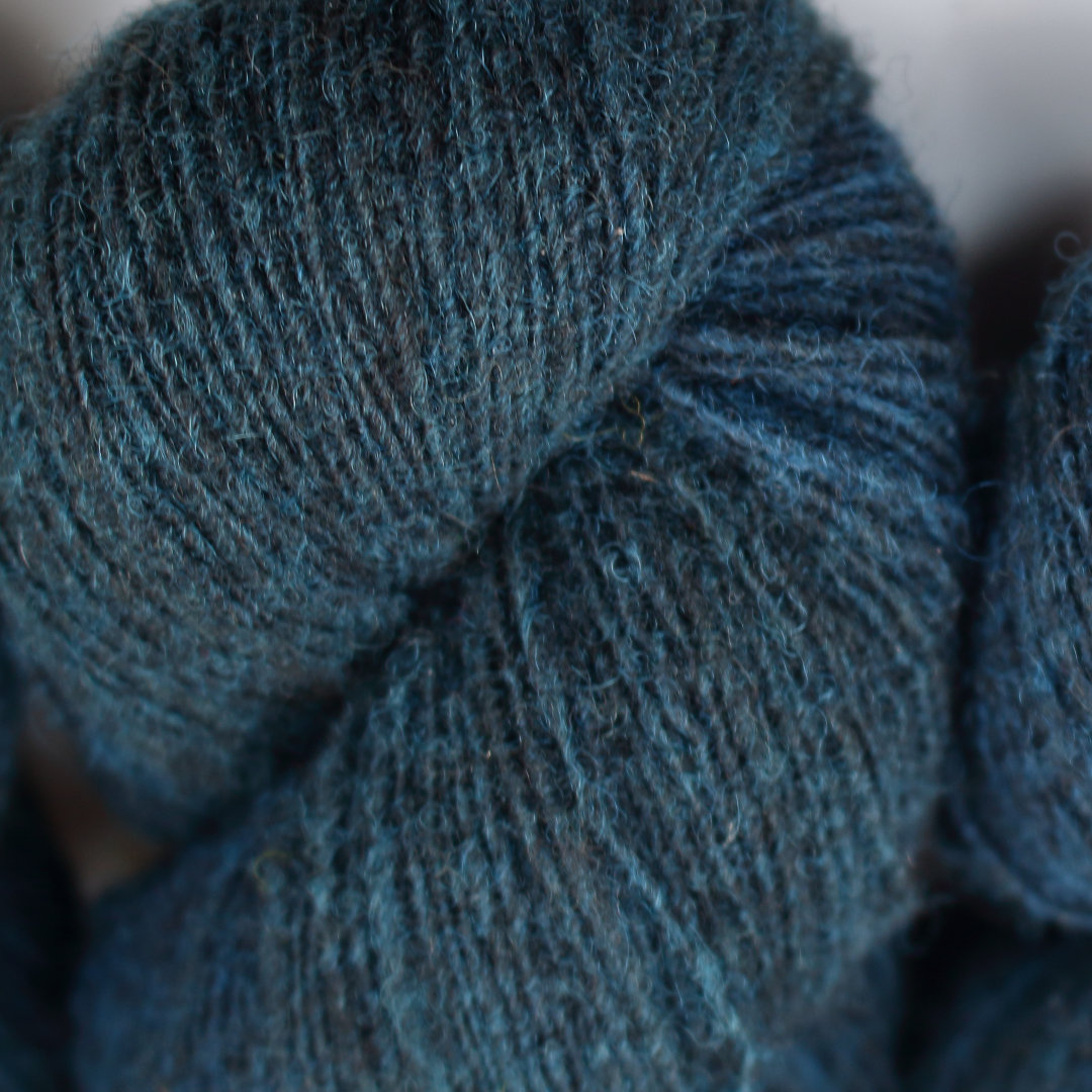 Deep dark teal skeins of Shetland Lace