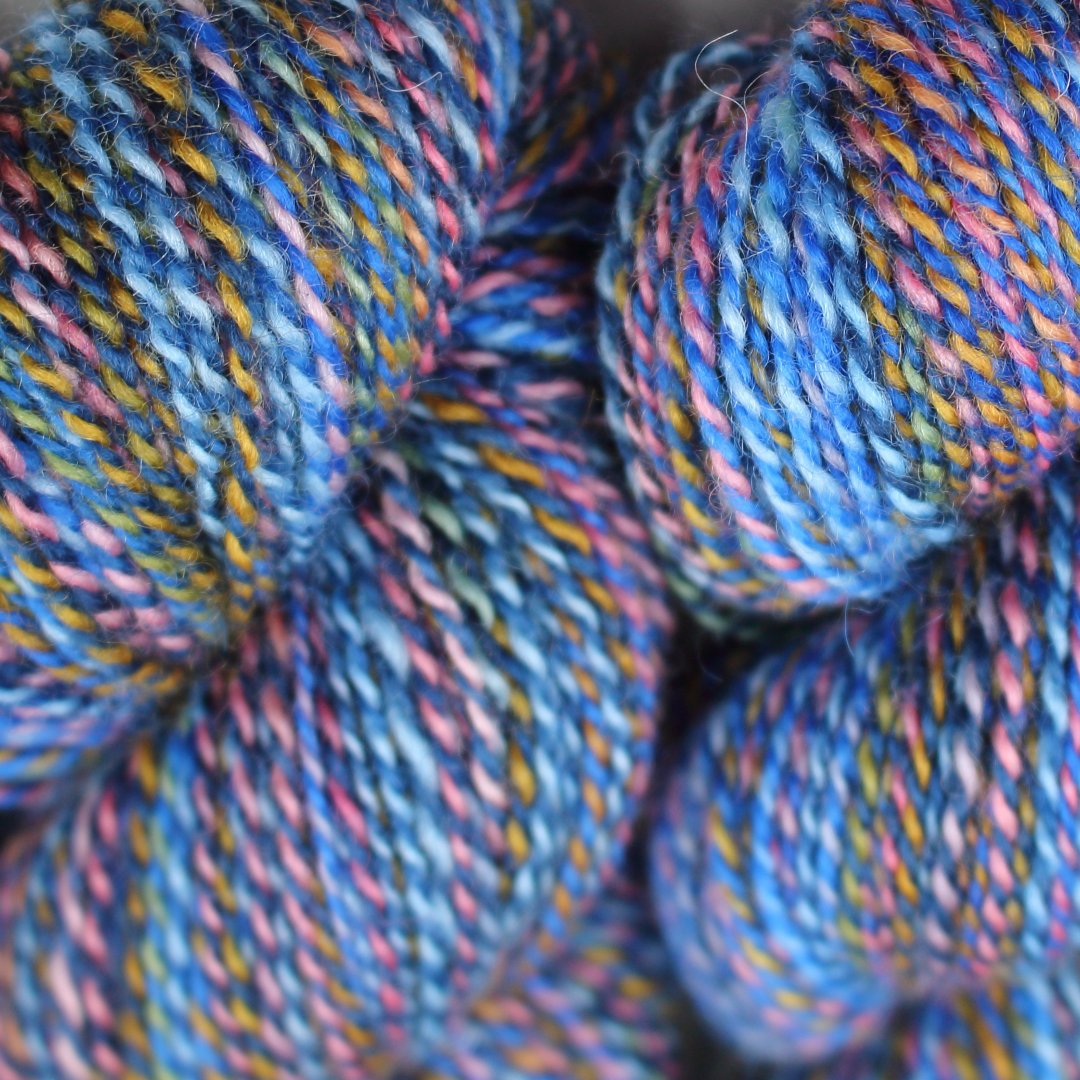 Bright blue marled skeins of Chimera