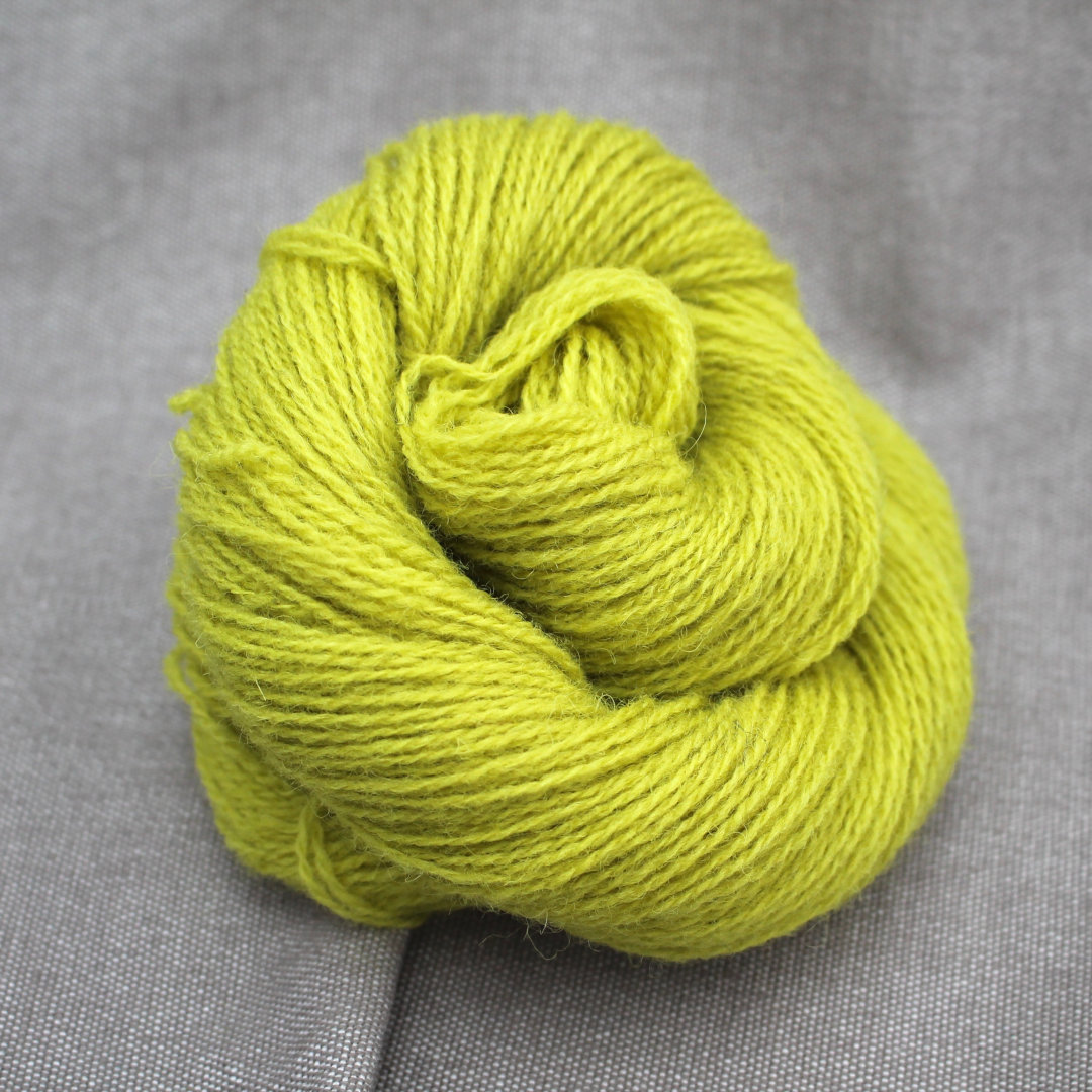 Chartreuse / acid yellow dyed skein of Severn 4 Ply