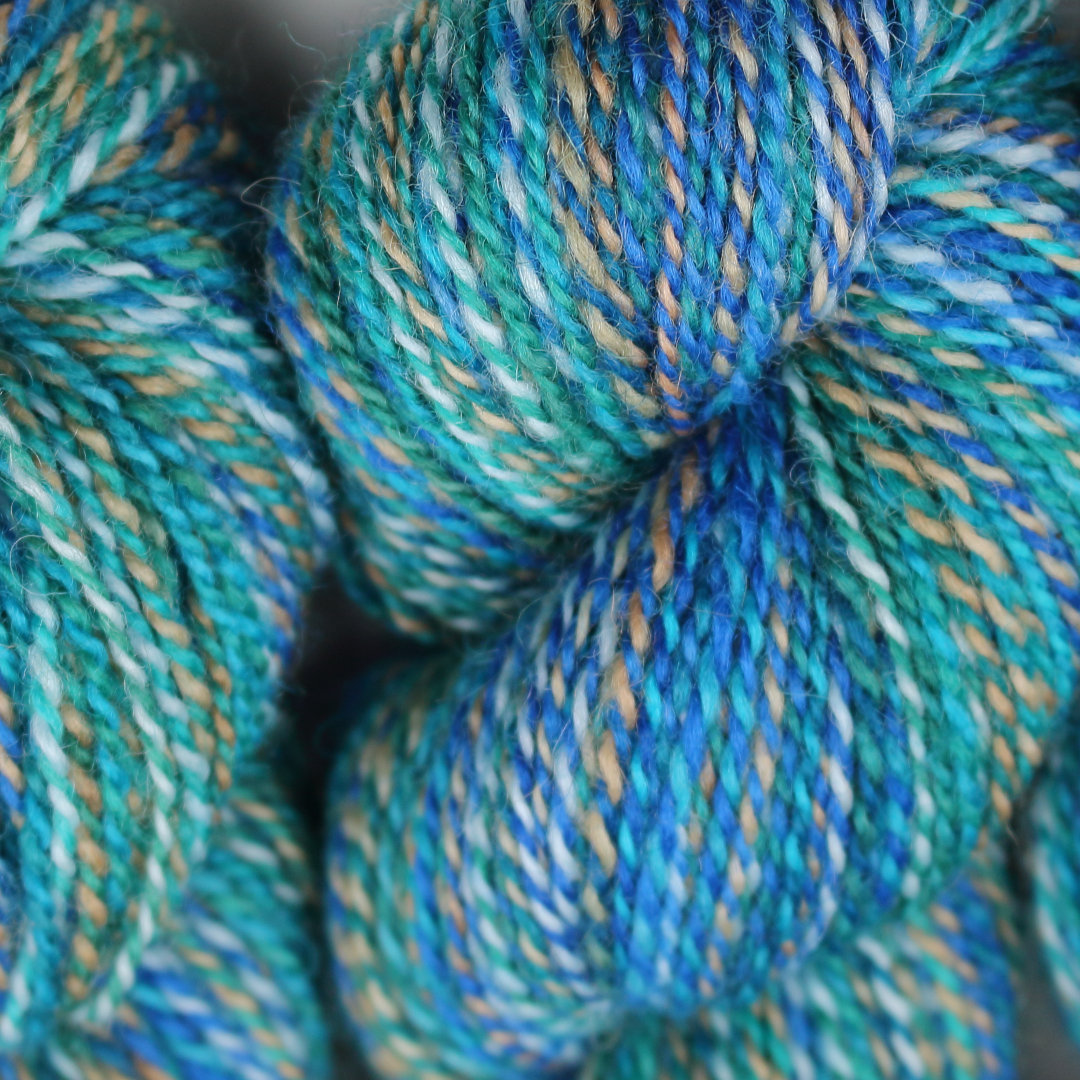 Bright turquoise marled skeins of Chimera