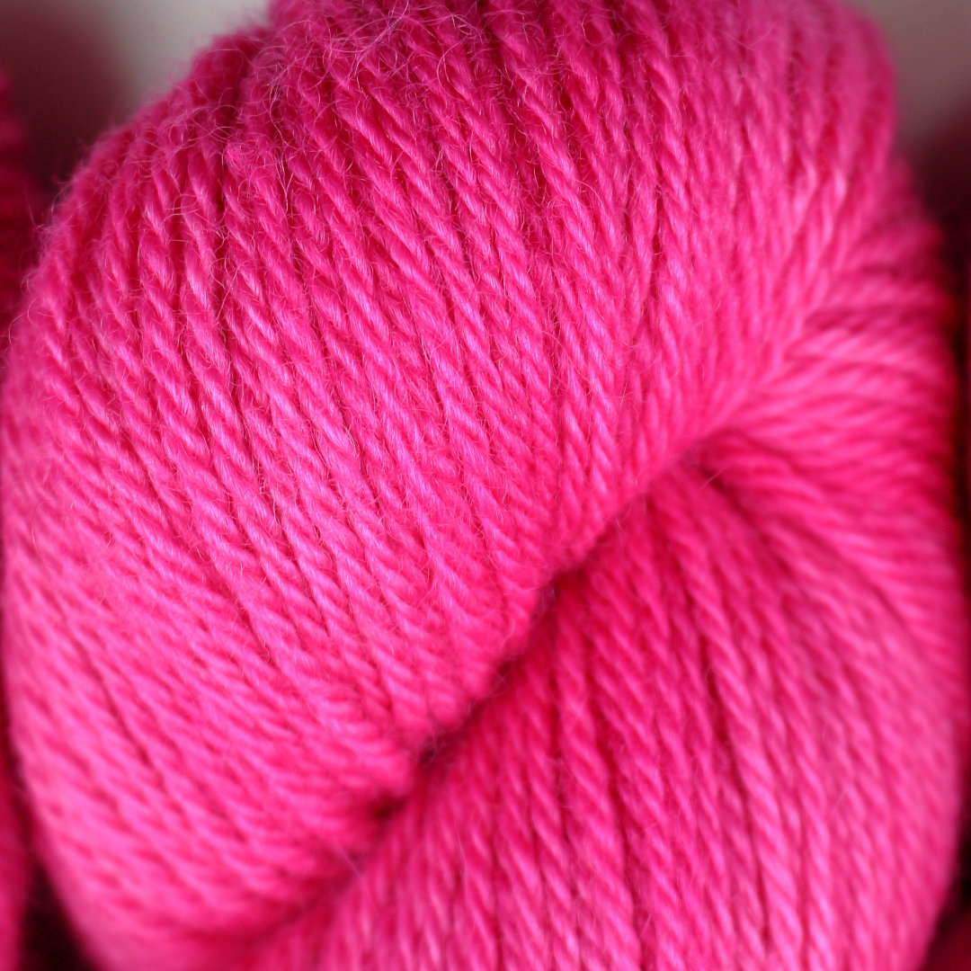 Bright pink skeins of Nene DK