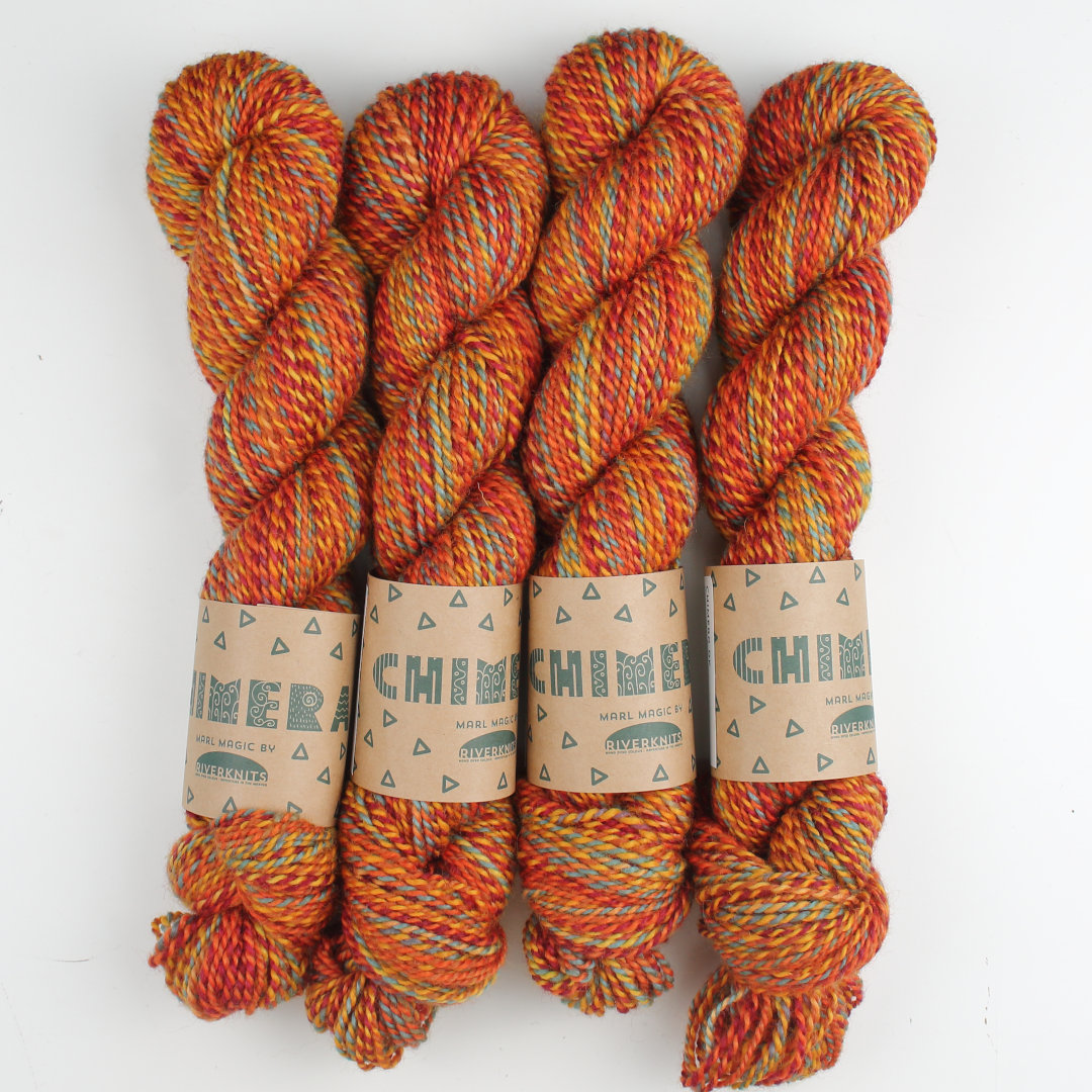 Warm orange marled skeins of Chimera