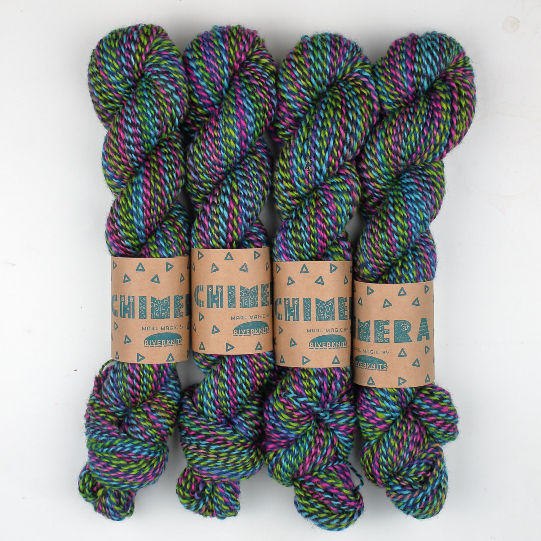 Black, lime, and hot pink marled skeins of Chimera