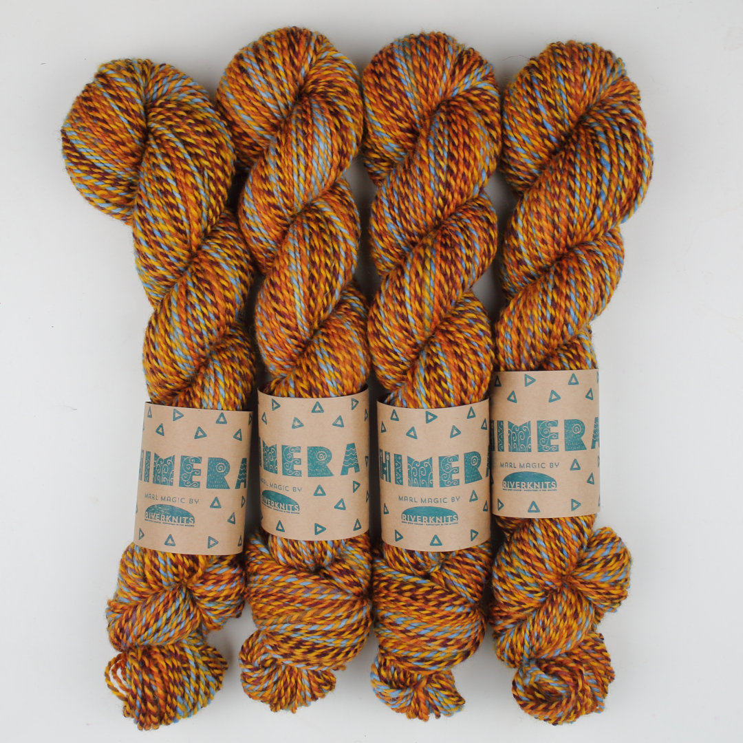 Warm yellow and brown marled skeins of Chimera