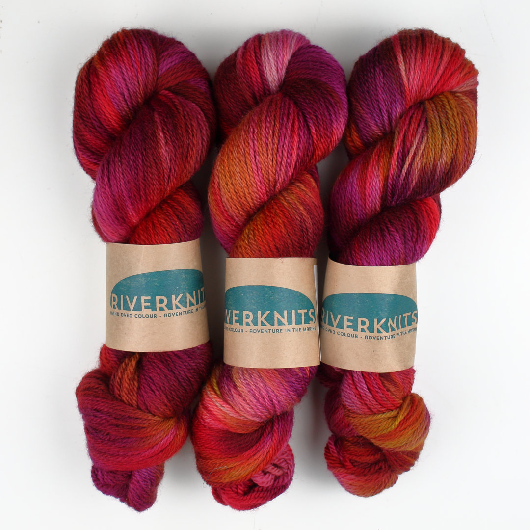 Variegated skeins of rich plum purples and reds.