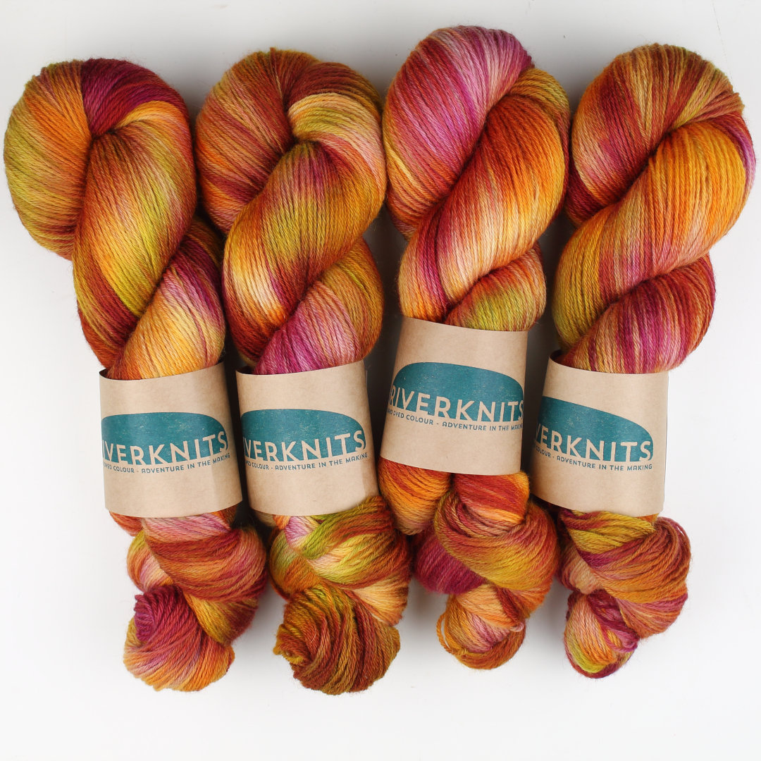 Variegated skeins of rhubarb colours, purples, creams, and greens.