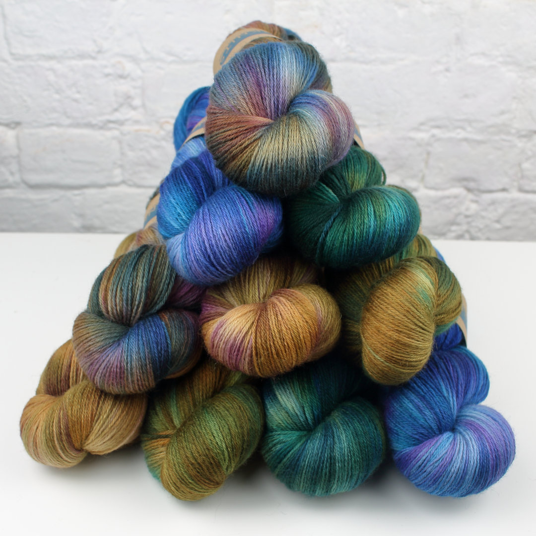 A pile of skeins in all the colourways of the Beachcomber collection